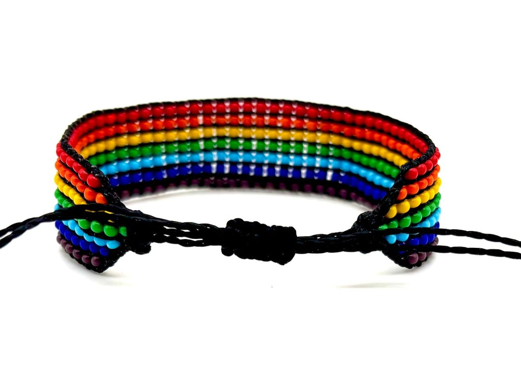 Rainbow striped beaded bracelet with premium glass beads on black leather, handcrafted in Guatemala, fair trade.