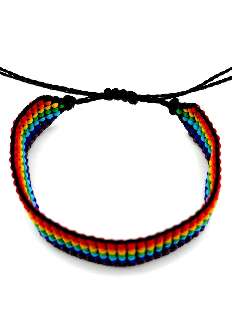 Rainbow-striped beaded bracelet with premium glass beads, handmade and fair trade. Perfect for a colorful accessory.